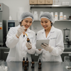 Lab Lustre skincare scientists collaborating on innovative formulations.